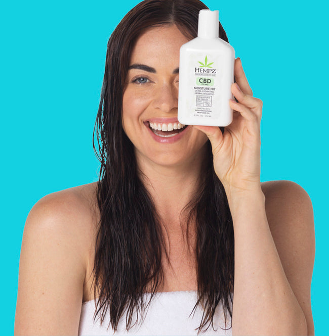Model holding ultra-moisturizing shampoo with 170 MG of CBD.